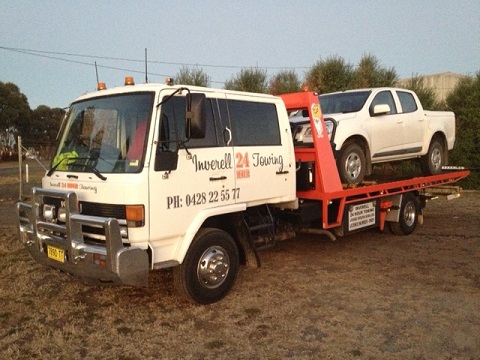 An Inverell 24 Hour Towing truck loading a ute
